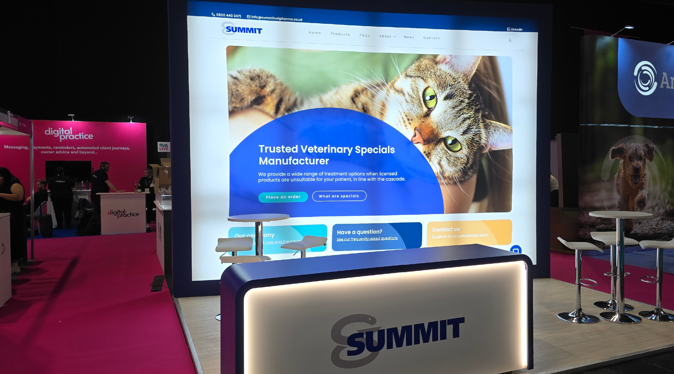 The Summit stand at BVA Live, showing the website homepage on a large, backlit wall