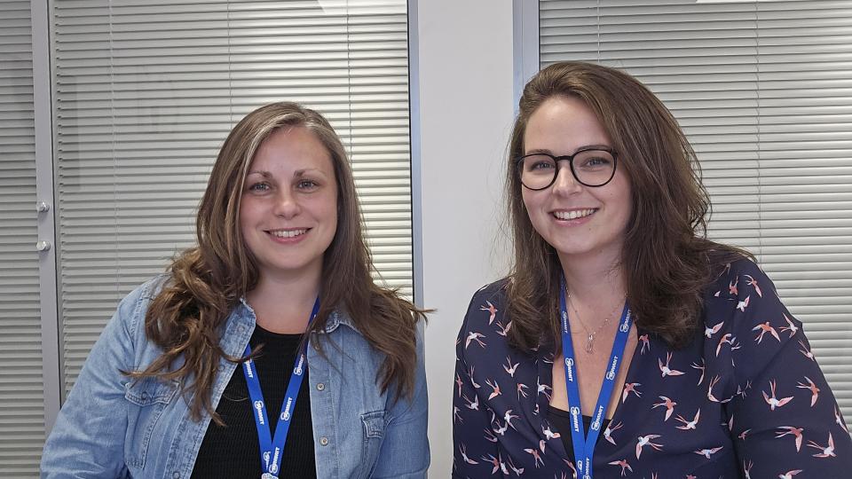 Rachel Bell and Zoe Johnson smiling at the camera
