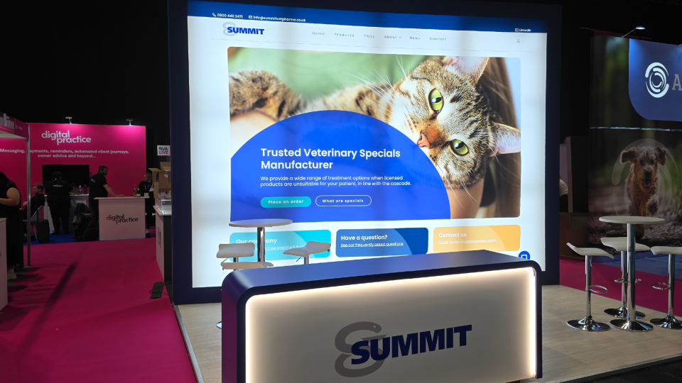 The Summit stand at BVA Live, showing the website homepage on a large, backlit wall