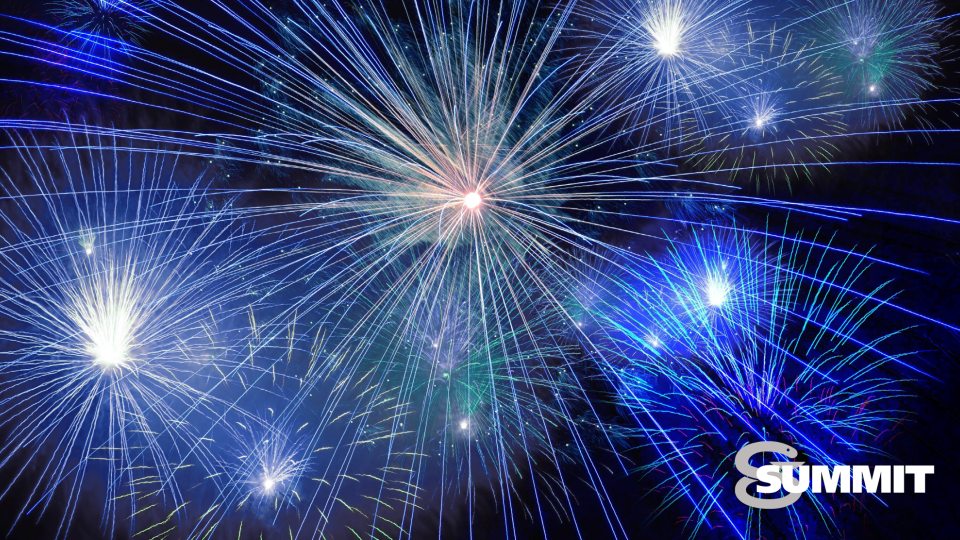 Fireworks bursting in a variety of blues and whites in a dark sky. The white Summit logo is positioned bottom right.