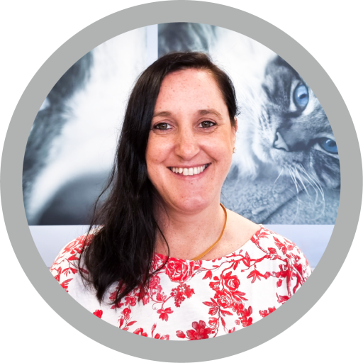 This is a photograph of Emma McAnally. She has brunette hair and is smiling at the camera.