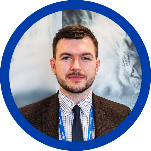 This is a photograph of Marc MacInnes. He has brunette hair and is smiling at the camera.